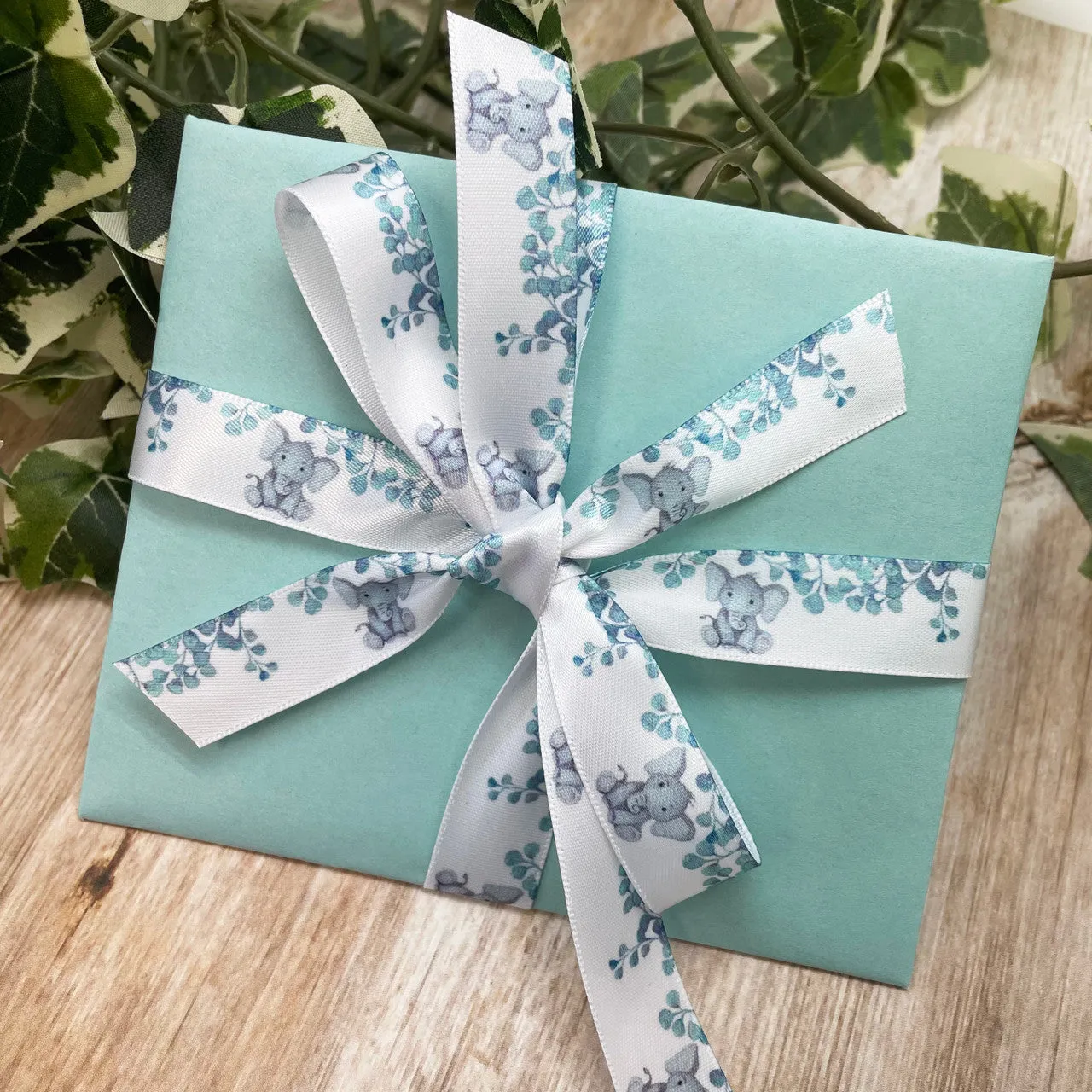 Baby Elephant ribbon with eucalyptus leaves printed on 5/8" white satin