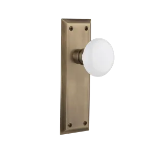 New York Long Plate with White Porcelain Knob in Antique Brass