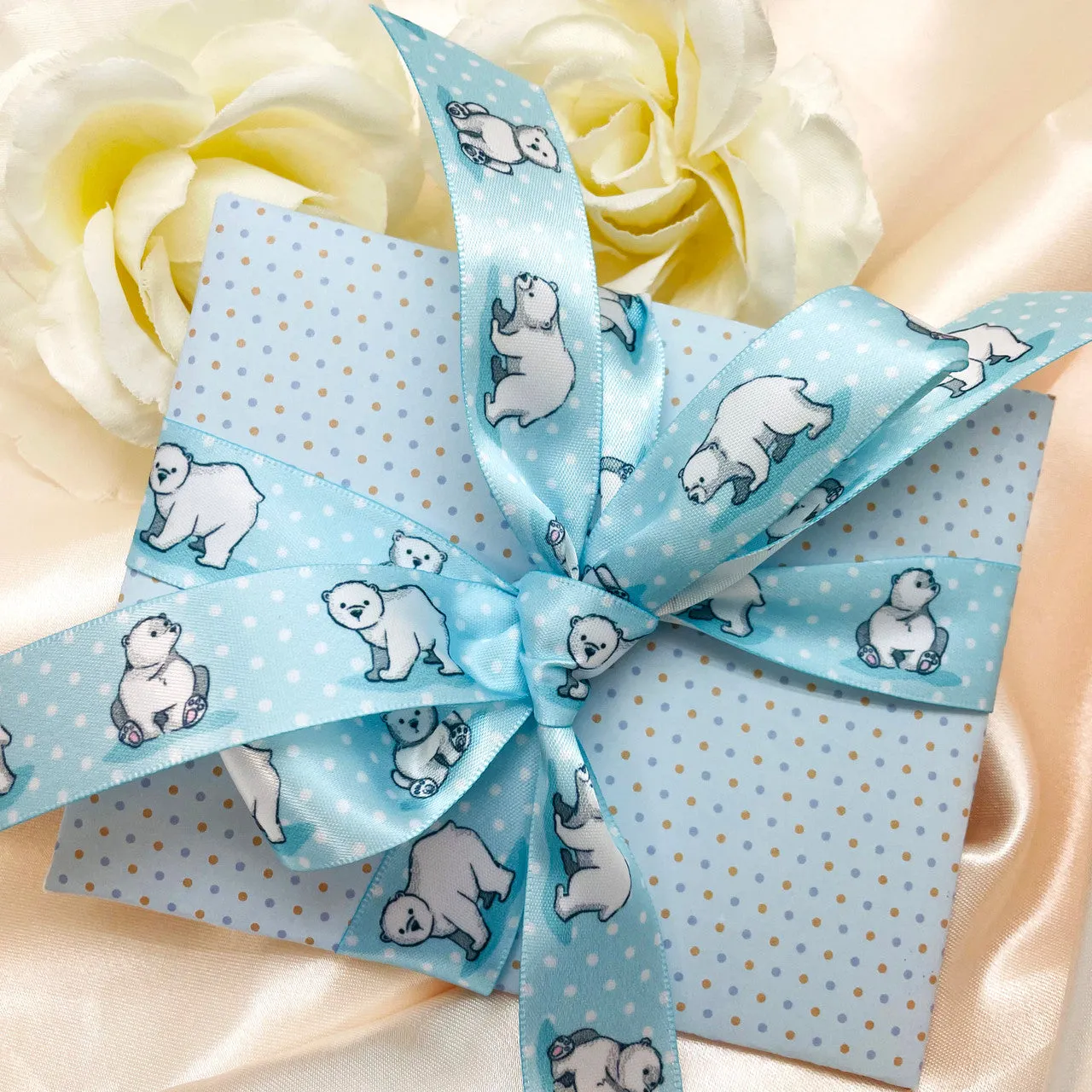 Polar Bear ribbon Polar bears on a blue and white dotted background printed on 7/8" white satin